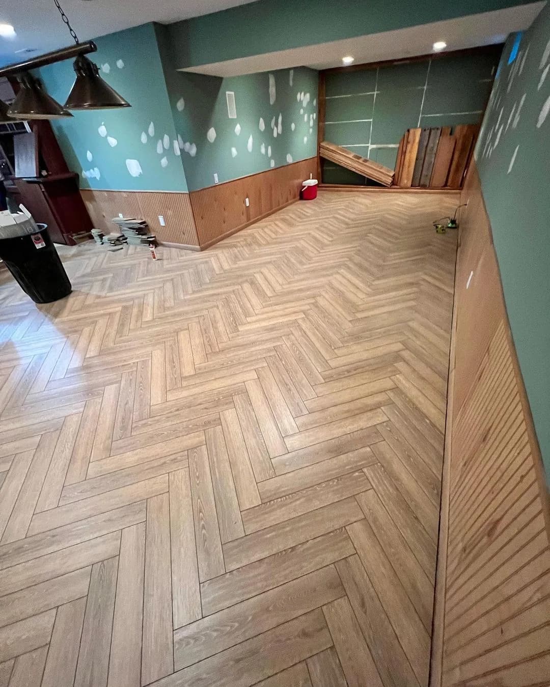 LVP flooring installed in a herringbone pattern